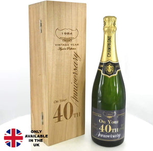 Bouteille de champagne de 75 cl personnalisée pour le 40e anniversaire de la naissance d'un enfant, présentée dans un coffret en bois gravé.