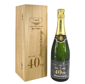 Bouteille de champagne de 75 cl personnalisée pour le 40e anniversaire de la naissance d'un enfant, présentée dans un coffret en bois gravé.